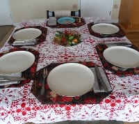 simple setting with a centerpiece of fresh boughs from the garden