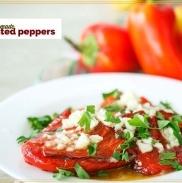 roasted peppers on a plate with text overlay "homemade roasted peppers"