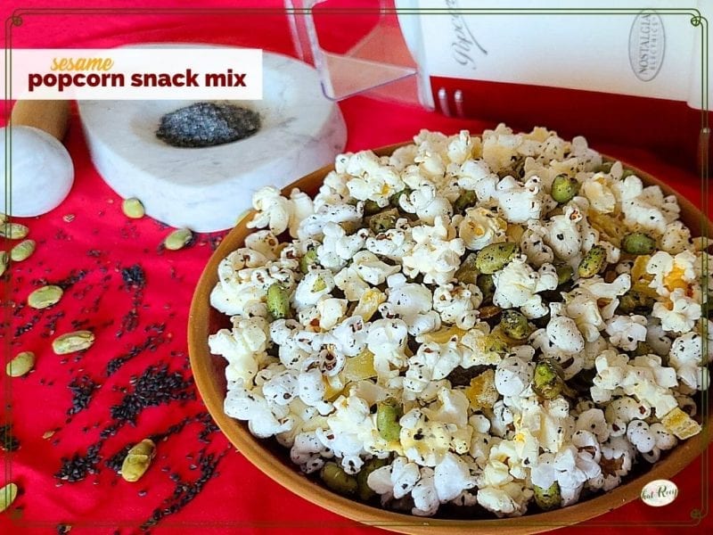 bowl of popcorn snack mix with text overlay "sesame popcorn snack mix"