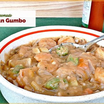 bowl of gumbo with bottle of hot sauce and text overlay "homemade cajun gumbo"