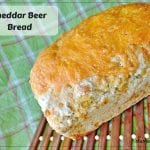 Cheddar Beer Bread - easy quick bread made with beer and loaded with cheddar cheese in and on top of the bread.