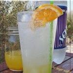 summer drink on a table outside with text overlay "Citrus Squash"