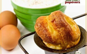 close up of popover in a pan with text overlay "Julia Child's Popovers"