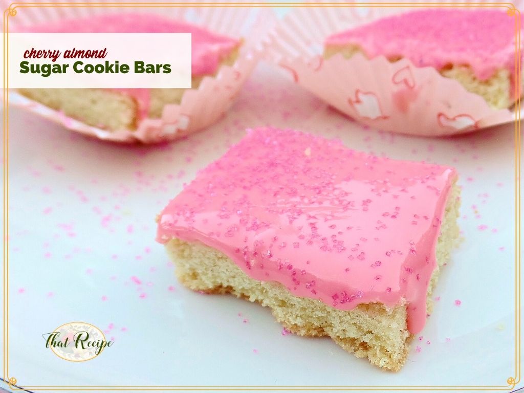 pink frosted cookie bars with text overlay "Cherry Almond Sugar Cookies"
