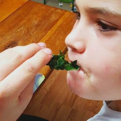 boy eating kale chips