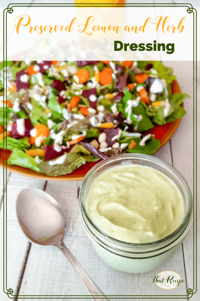 preserved lemon and herb salad dressing in a jar with a plate of salad and a text overlay