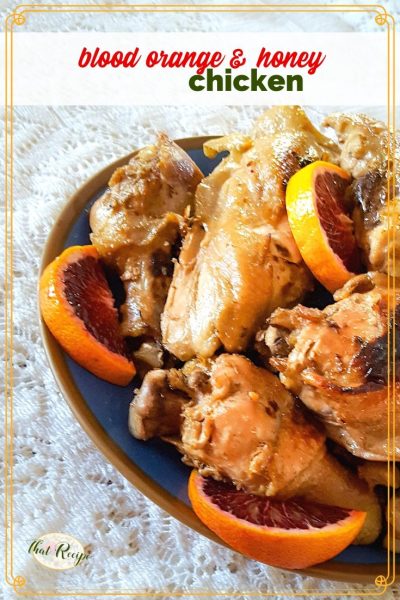plate of cooked chicken pieces with blood orange slices and text overlay "Blood orange and honey chicken"