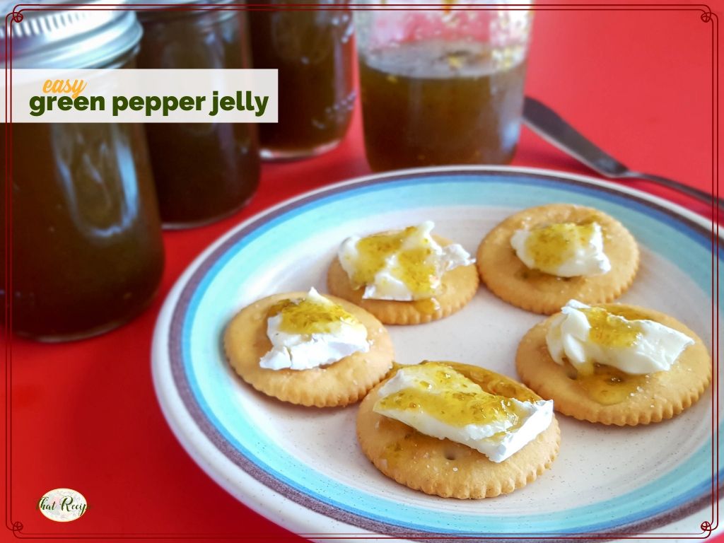 crackers with brie and green pepper jelly on a plate with jars of jalapeno jelly and text overlay "easy green pepper jelly"