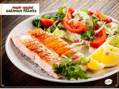 roasted salmon on a plate with a salad and text overlay "maple roasted salmon fillets"