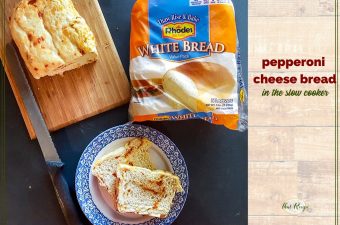 sliced loaf of pepperoni cheese bread made in a slow cooker with bag of Rhodes Bake nServ bread