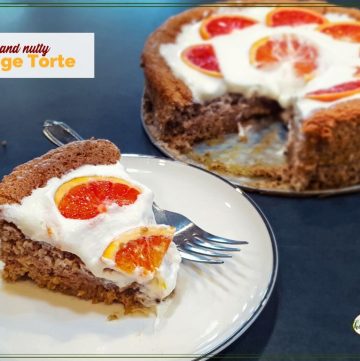 Nut torte with whipped cream and fresh orange slices with text overlay "Orange Pecan Torte"