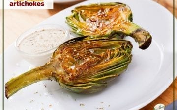 artichoke halves on a plate with dipping sauce ad text overlay "herb roasted artichokes"