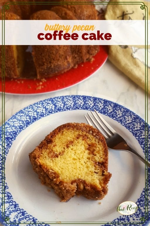 coffee cake slice on a plate with full cake in background with text overlay "buttery pecan coffee cake"