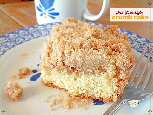 slice of coffee cake on plate with coffee mug in background and text overlay "New York style crumb cake"