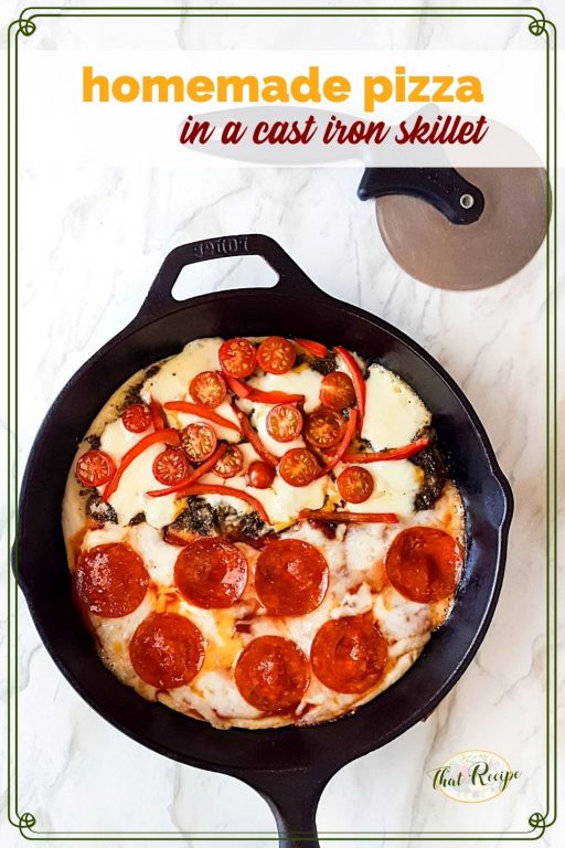 top down view of cast iron skillet pizza with text overlay "Homemade pizza in a cast iron skillet"