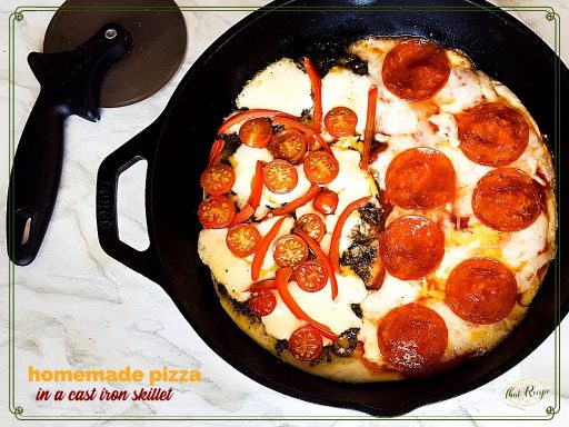 top down view of cast iron skillet pizza with text overlay "Homemade pizza in a cast iron skillet"