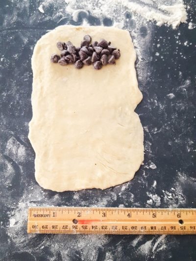 chocolate chips on croissant dough