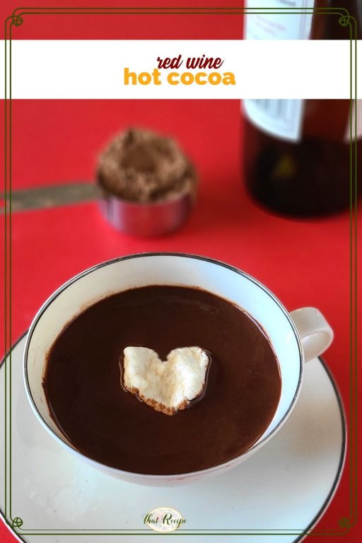 cup of cocoa with heart shaped marshmallow and text overlay "red wine hot cocoa"