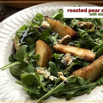 roasted pears on arugula with text overlay "roasted Pear Salad with blue cheese"