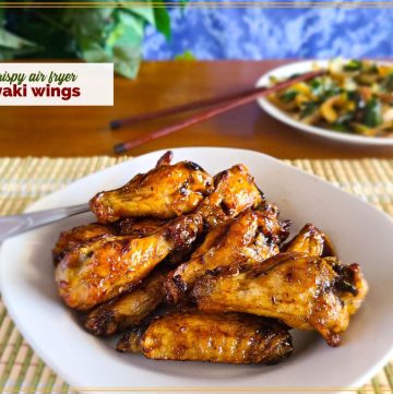 glazed chicken wings on a plate with text overlay "air fryer teriyaki chicken wings"