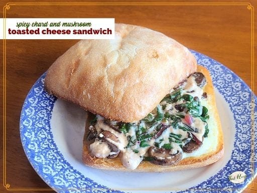 sandwich on a plate with text overlay "chard and mushroom toasted cheese sandwich"