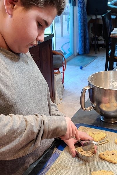boy making cookies