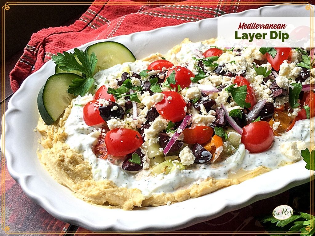 Layered hummus dip with text overlay "Mediterranean Layer Dip"