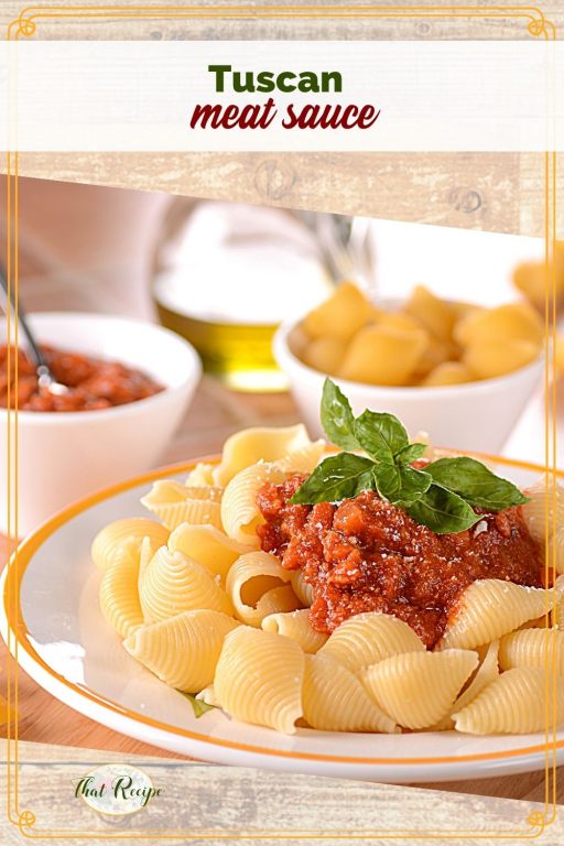 pasta with meat sauce on a plate with text overlay "tuscan meat sauce"