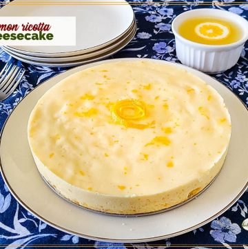 homemade cheesecake on a plate with text overlay "lemon ricotta cheesecake"