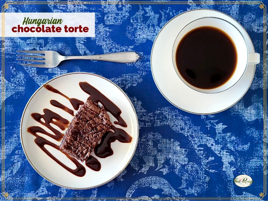 slice of chocolate torte on a plate drizzled in chocolate sauce with text overlay "Hungarian chocolate torte"