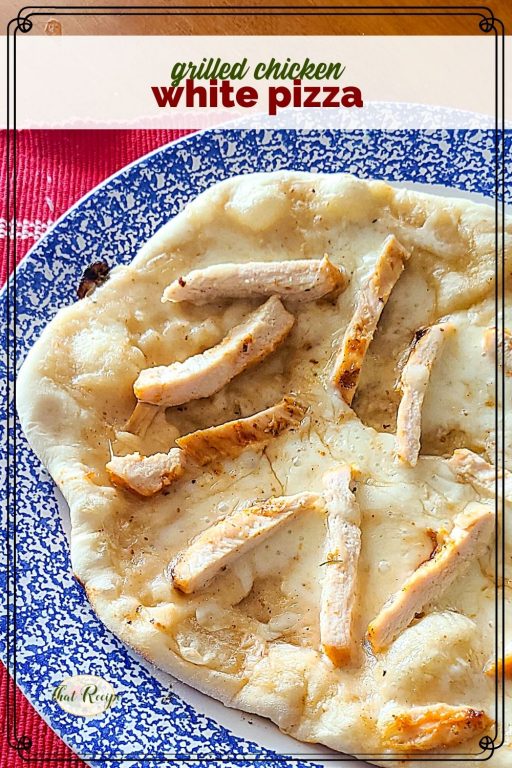 top down view of individual pizza on a plate with text overlay "grilled chicken white pizza".