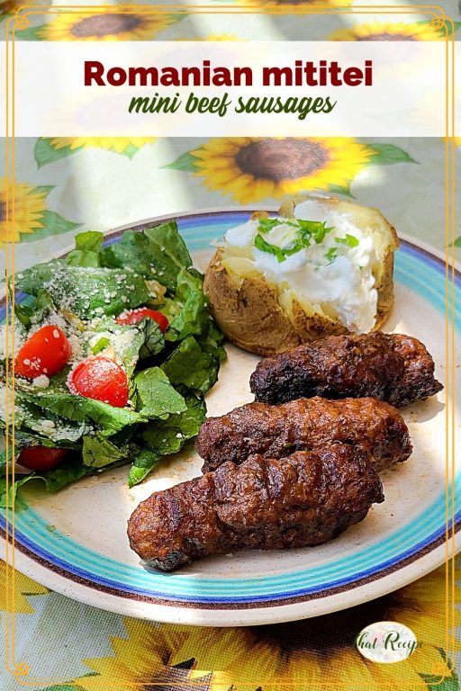 mini sausages on a plate with salad and potato and text overlay "Romanian mititei mini beef sausages"