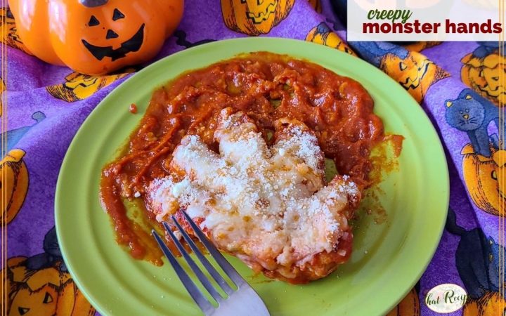 chicken breast cut into a hand on a plate of tomato sauce with text overlay "creepy monster hands"