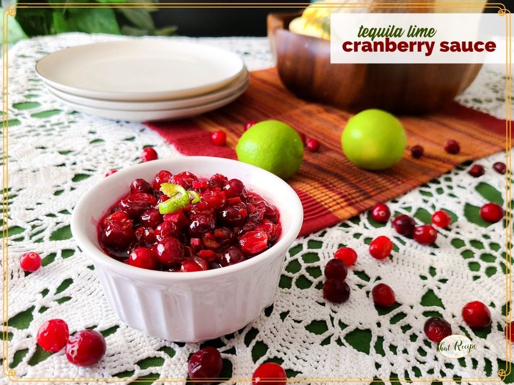 bowl of cranberry sauce on a table with text overlay "tequila lime cranberry sauce"