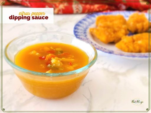 bowl of orange sauce with text overlay "citrus pepper dipping sauce"