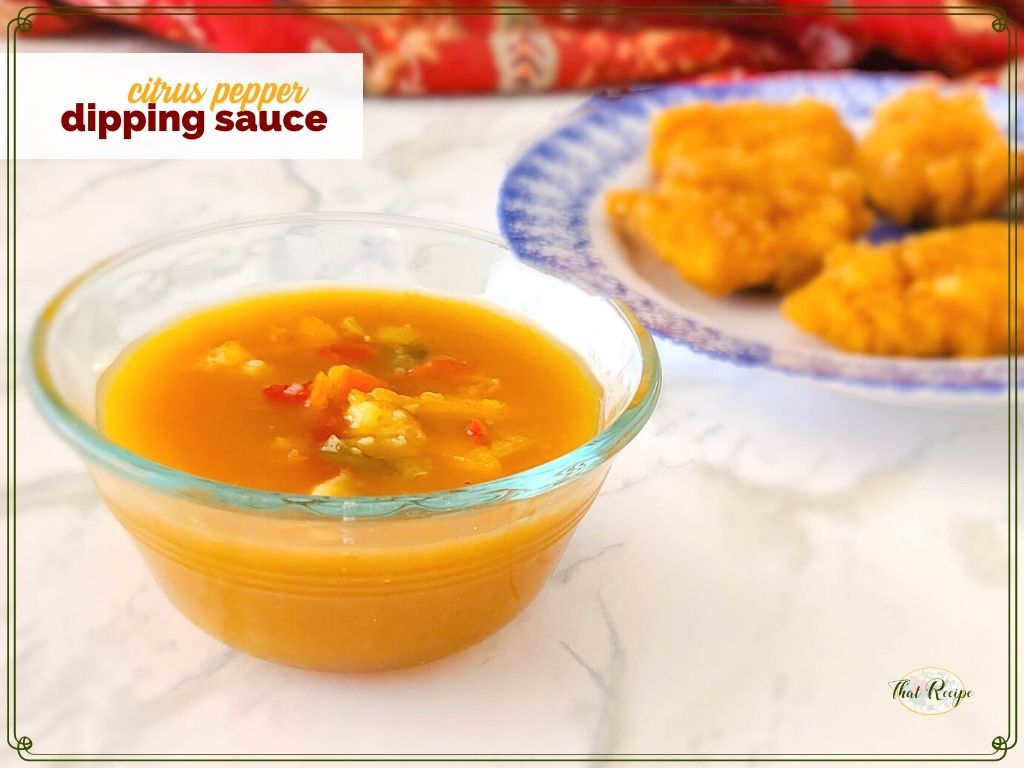 bowl of orange sauce with text overlay "citrus pepper dipping sauce"