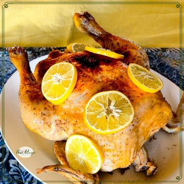 whole chicken topped with lemon