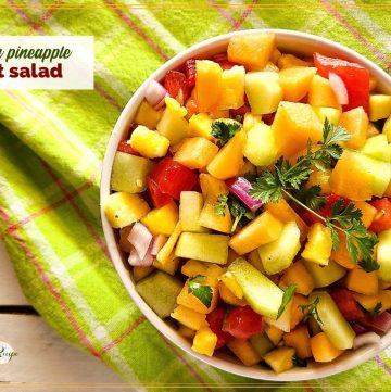 Fruit salad in a bowl with text overlay "Melon Pineapple Fruit Salad"