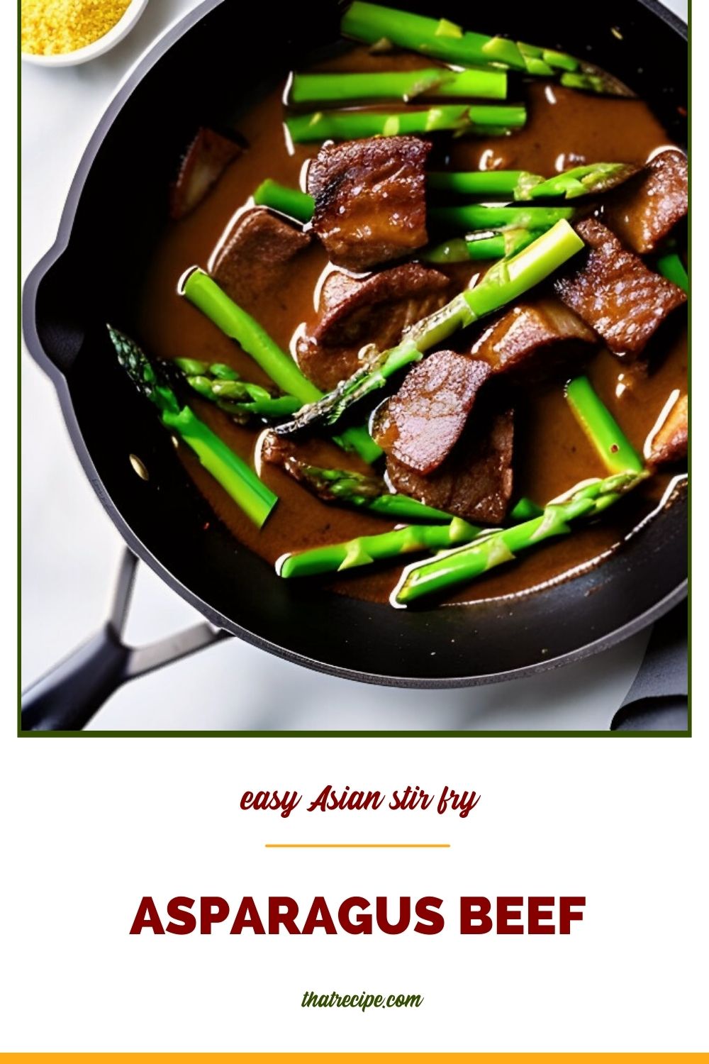 beef tips and asparagus in dark sauce in a skillet