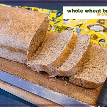 loaf of whole wheat bread on a cutting board with a bread knife and text overlay "Whole Wheat Bread in one hour"
