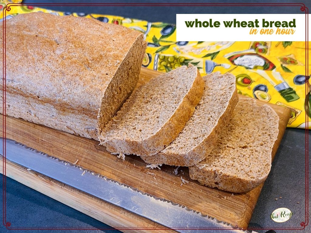 loaf of whole wheat bread on a cutting board with a bread knife and text overlay "Whole Wheat Bread in one hour"