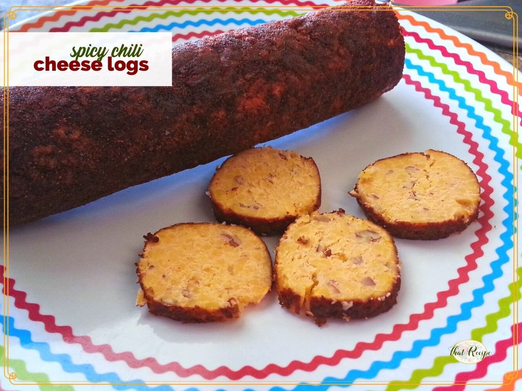 sliced chili cheese roll on a plate text overlay "spicy chili cheese logs"
