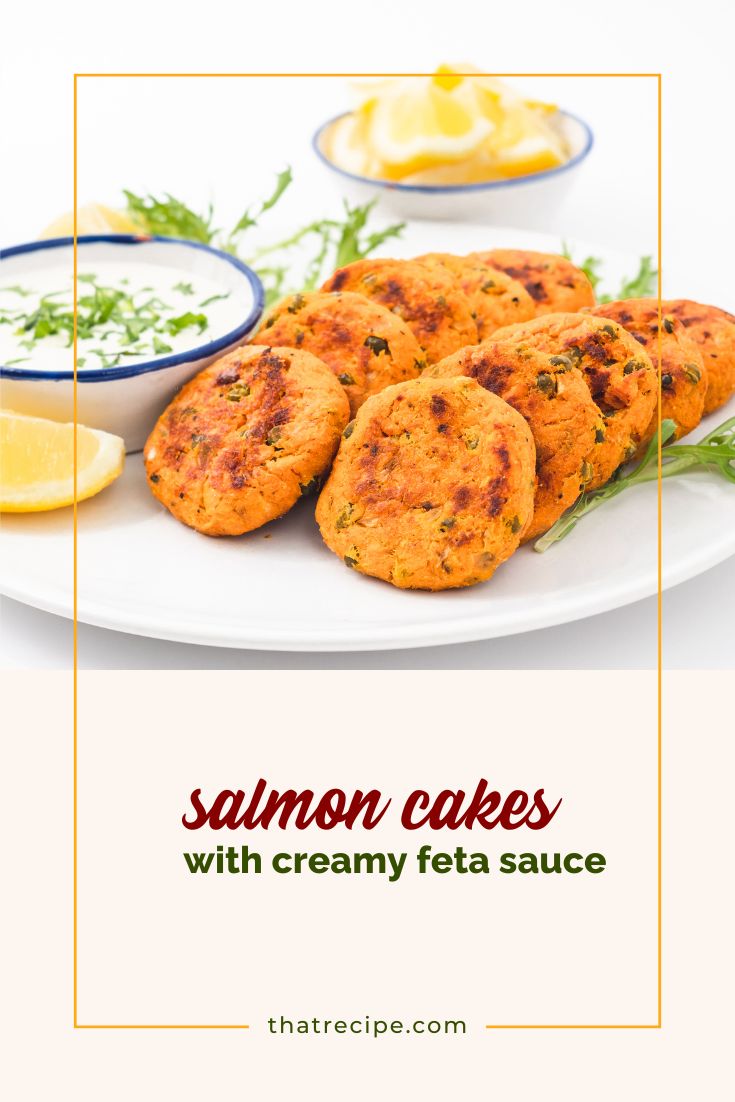 salmon cakes on a plate with creamy feta sauce