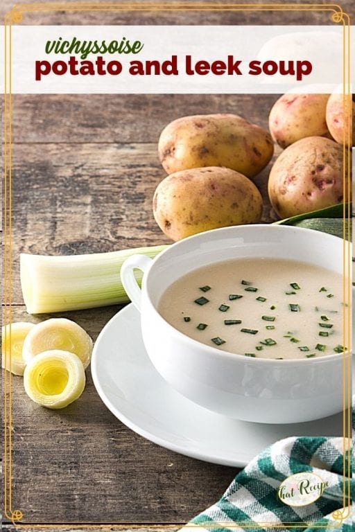 potato soup in a bowl surrounded by potatoes and leeks and text overlay "vichyssoise potato and leek soup"