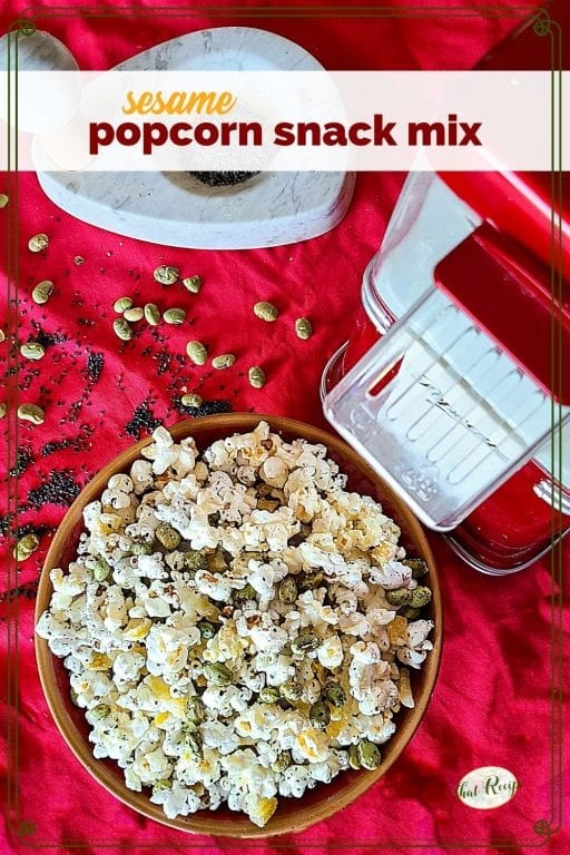 bowl of popcorn snack mix with text overlay "sesame popcorn snack mix"