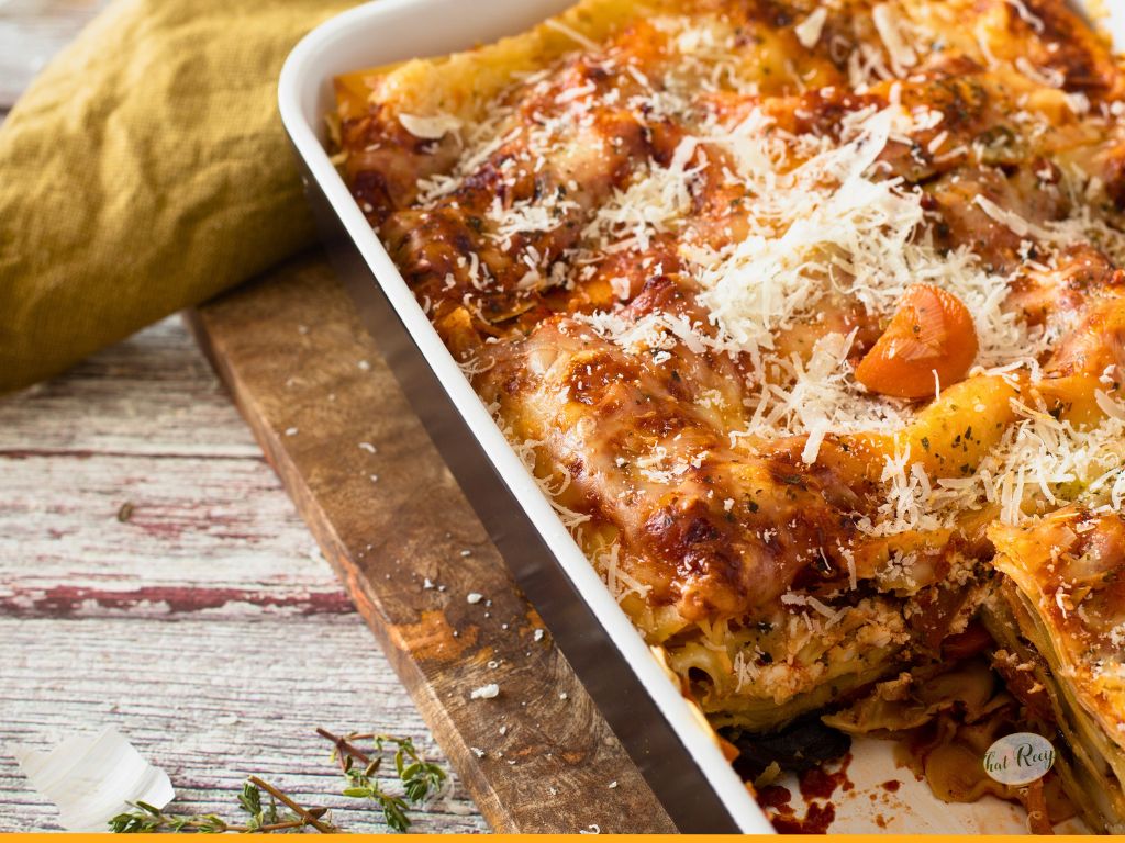 tray of meat lasagna on a wood table