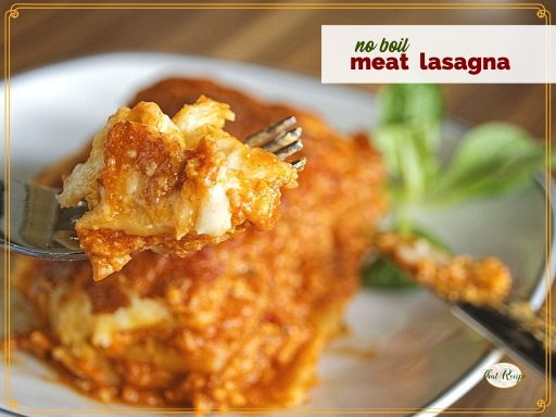fork holidng a piece of lasagna with text overlay "no boil meat lasagna"