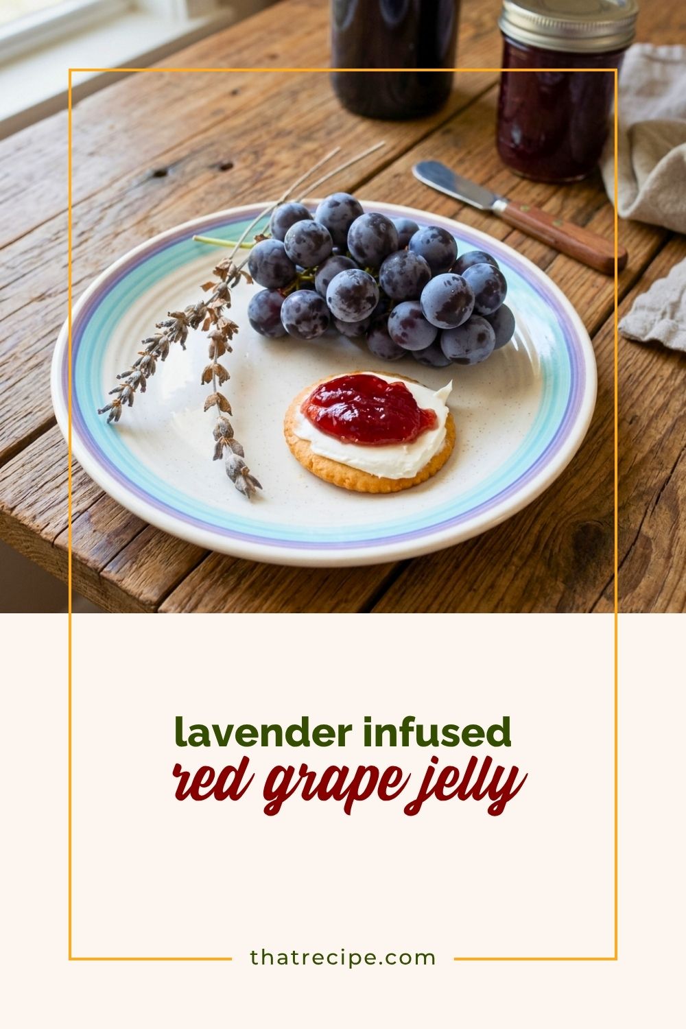 lavender stalks, bunch of red grapes, cracker with cream cheese and grape jelly