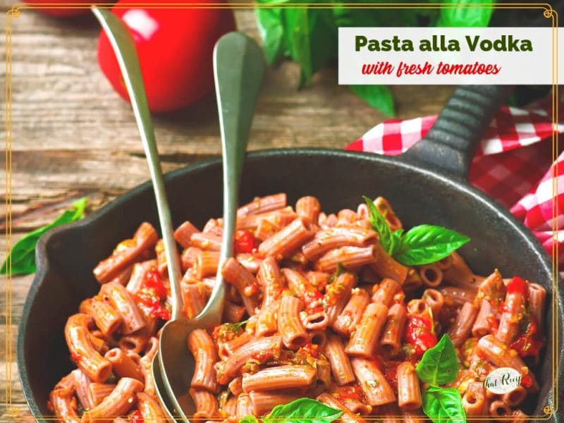 pasta in a skillet with text overlay "Pasta alla Vodka with fresh tomatoes"