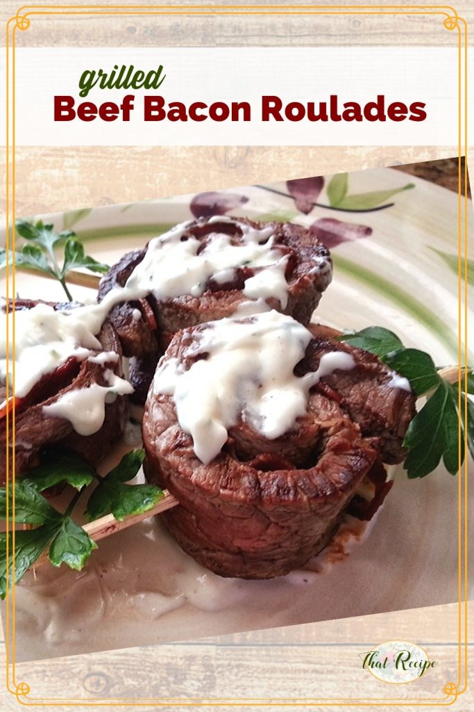 rolled beef skewers on a plate with text overlay "Beef & Bacon Roulades"